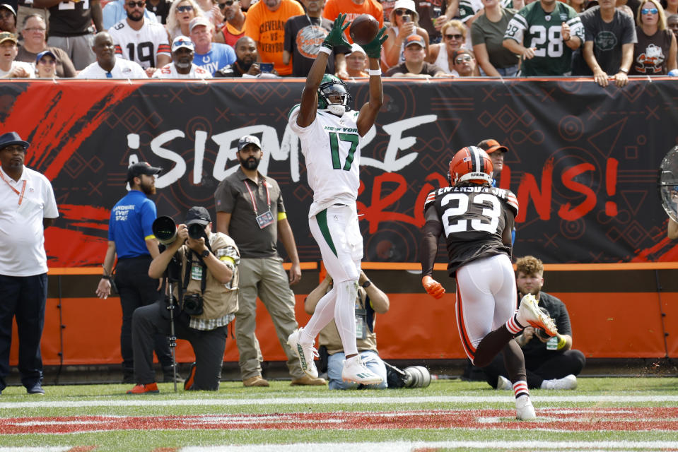New York Jets wide receiver Garrett Wilson (17) makes a touchdown catch as Cleveland Browns cornerback Martin Emerson Jr. (23) defends during the first half of an NFL football game, Sunday, Sept. 18, 2022, in Cleveland. (AP Photo/Ron Schwane)