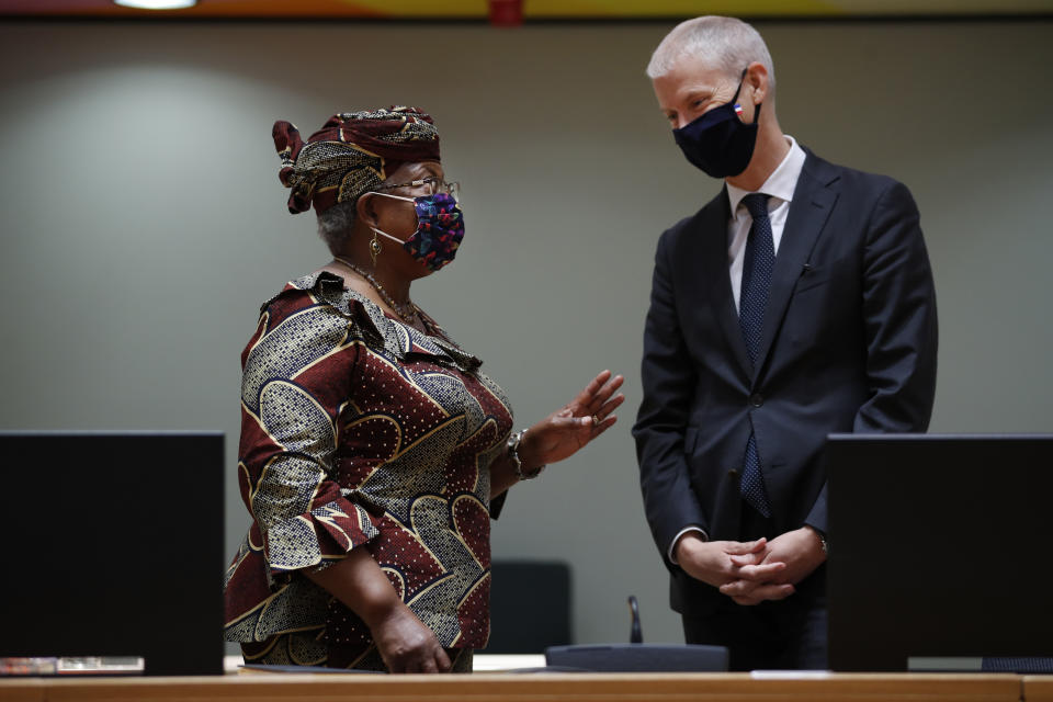 World Trade Organization Director-General Ngozi Okonjo-Iweala, left, talks to France's Foreign Trade Minister Franck Riester during a European Foreign Trade ministers meeting at the European Council headquarters in Brussels, Thursday, May 20, 2021. (AP Photo/Francisco Seco, Pool)