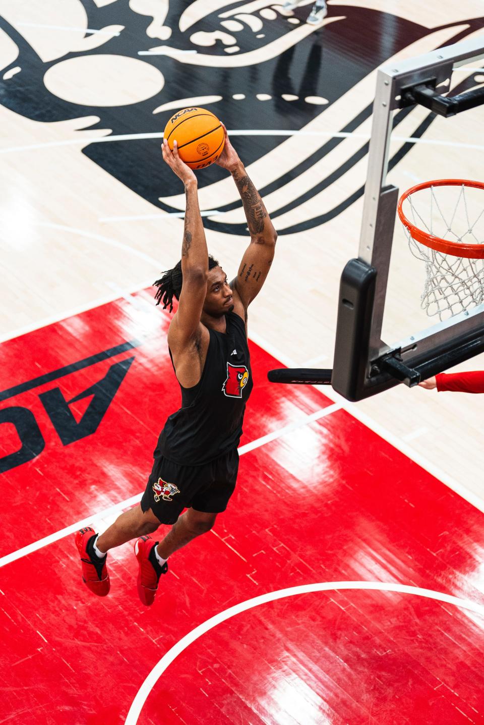 James Scott prepares for a dunk during a Louisville summer basketball practice at Planet Fitness Kueber Center.  Scott is a sophomore and played for new Cardinals coach Pat Kelsey in Charleston during the 2023-24 season.