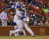 Los Angeles Dodgers' Manny Machado hits a home run off off St. Louis Cardinals relief pitcher John Brebbia during the seventh inning of a baseball game Thursday, Sept. 13, 2018, in St. Louis. (AP Photo/Billy Hurst)