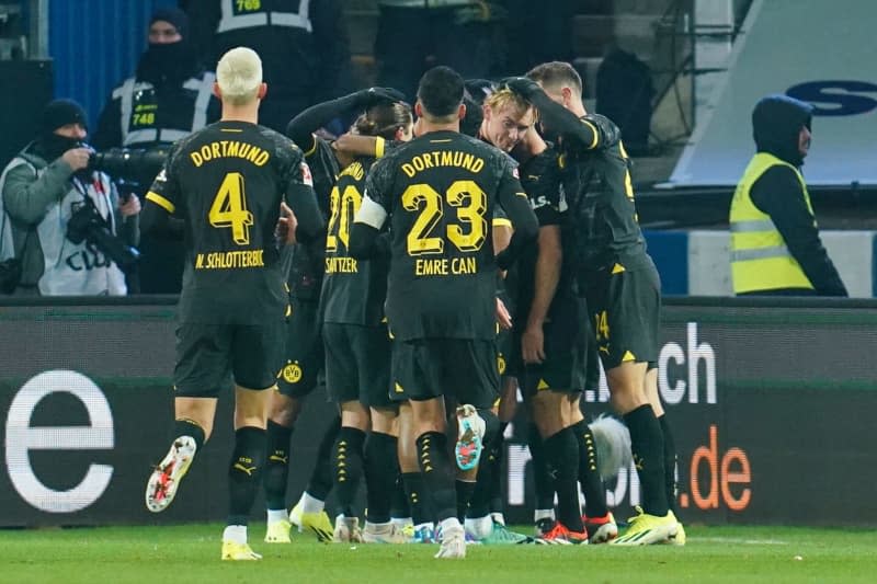Borussia Dortmund players celebrate their side's first goal of the game during the German Bundesliga soccer match between Darmstadt 98 and Borussia Dortmund at Merck Stadium. Uwe Anspach/dpa