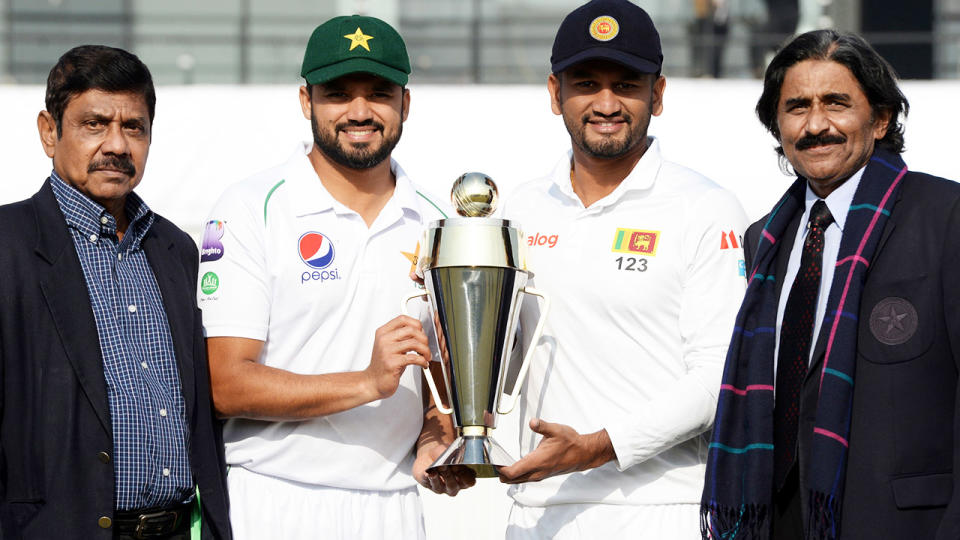 Bandula Warnapura, pictured here with Pakistan captain Azhar Ali and his Sri Lankan counterpart Dimuth Karunaratne in 2019.