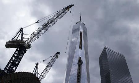 File photo of One World Trade Center tower and Seven World Trade Center (R) towering over lower Manhattan in New York May 2, 2014. REUTERS/Brendan McDermid