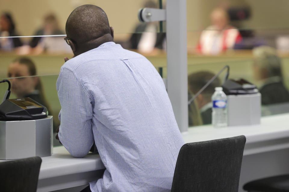 Defendents sit in a specially designed glass box in the courtroom during the start of the Brussels terrorist attack trial verdict in the Justitia building in Brussels, Tuesday, July 25, 2023. A jury is expected to render its verdict Tuesday over Belgium's deadliest peacetime attack. The suicide bombings at the Brussels airport and a busy subway station in 2016 killed 32 people in a wave of attacks in Europe claimed by the Islamic State group. (Olivier Matthys, Pool Photo via AP)