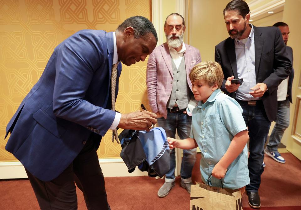 Rep. Burgess Owens, R-Utah, signs an autograph for Garrett Eschrich at The Dollars and Sense of Second Chance Hiring: A Utah Employer Engagement Forum, hosted by Right on Crime, at the Little America in Salt Lake City on Thursday, Aug. 24, 2023. | Kristin Murphy, Deseret News