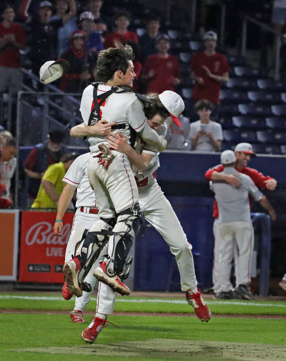 Relief pitcher Tommy Mitchell and catcher Jack Finnegan start the celebration.Milton High baseball wins the MIAA State Championship at Polar Park in Worcester on Friday June 16, 2023 