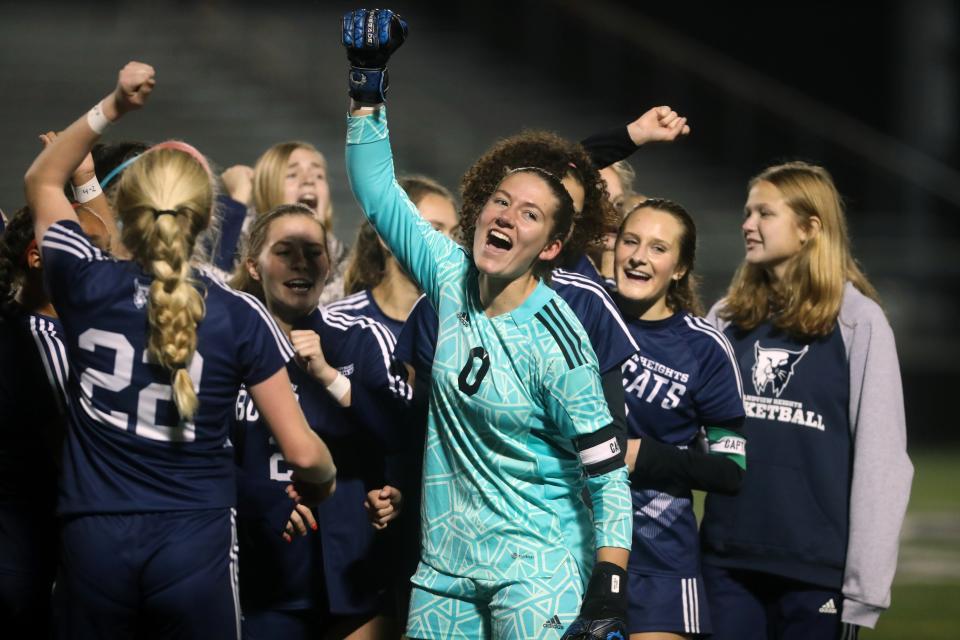Grandview Heights' Vivian Chute celebrates with teammates after a 3-2 win over Berlin Hiland in a Division III regional semifinal Nov. 1 at Westerville Central.