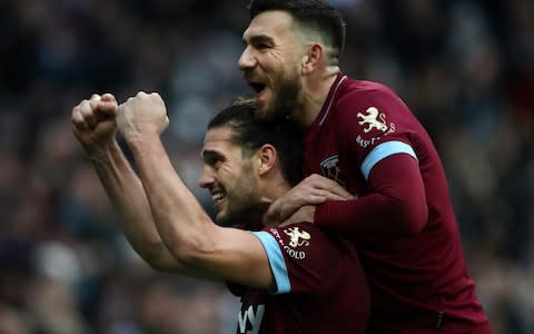 Andy Carroll of West Ham United celebrates with Robert Snodgrass after scoring his team's second goal during the FA Cup Third Round match between West Ham United and Birmingham City - Credit: GETTY IMAGES