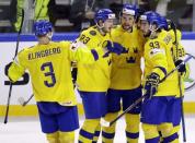 Ice Hockey - 2018 IIHF World Championships - Semifinals - Sweden v USA - Royal Arena - Copenhagen, Denmark - May 19, 2018 - Viktor Arvidsson of Sweden celebrates with teammates after scoring. REUTERS/David W Cerny