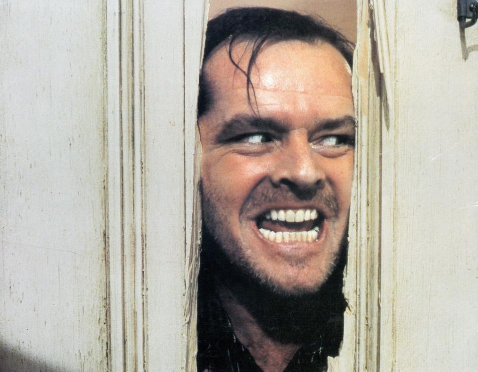 Heeere's Johnny: Jack Nicholson peers through a hole chopped into a door in "The Shining" [Warner Brothers]