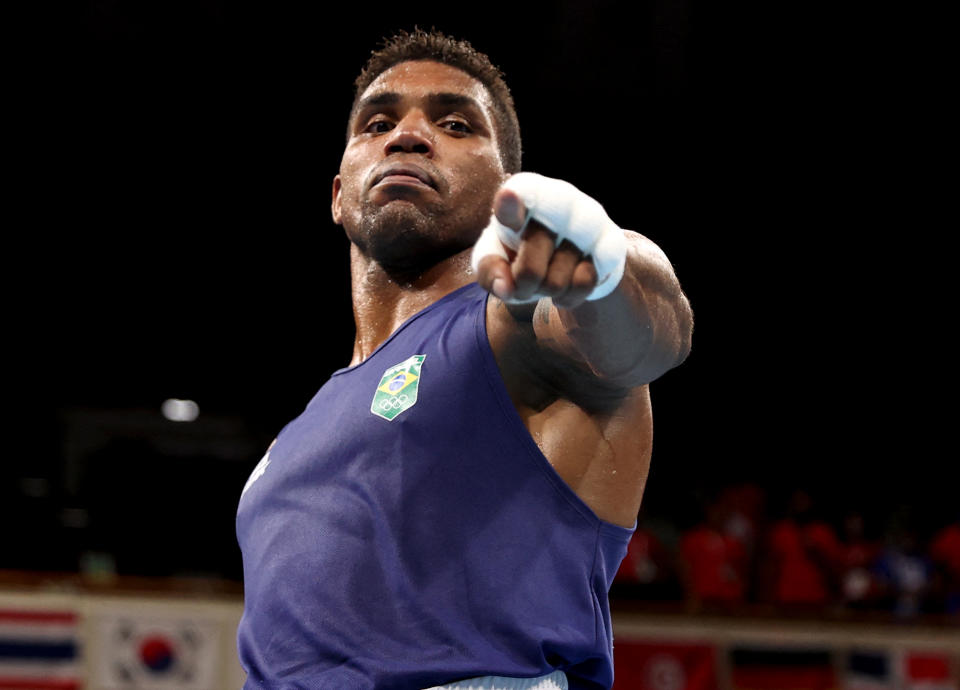 <p>Brazil's Abner Teixeira celebrates after winning his men's heavy (81-91kg) quarterfinal boxing match on July 30.</p>