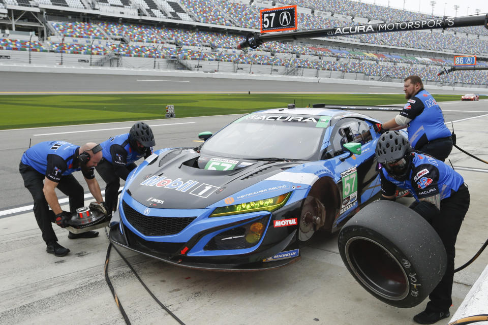 The car in the pits during practice for the Rolex 24 hour auto race at the Daytona International Speedway, in Daytona Beach Fla., on Thursday, Jan. 23, 2020. (AP Photo/Reinhold Matay)