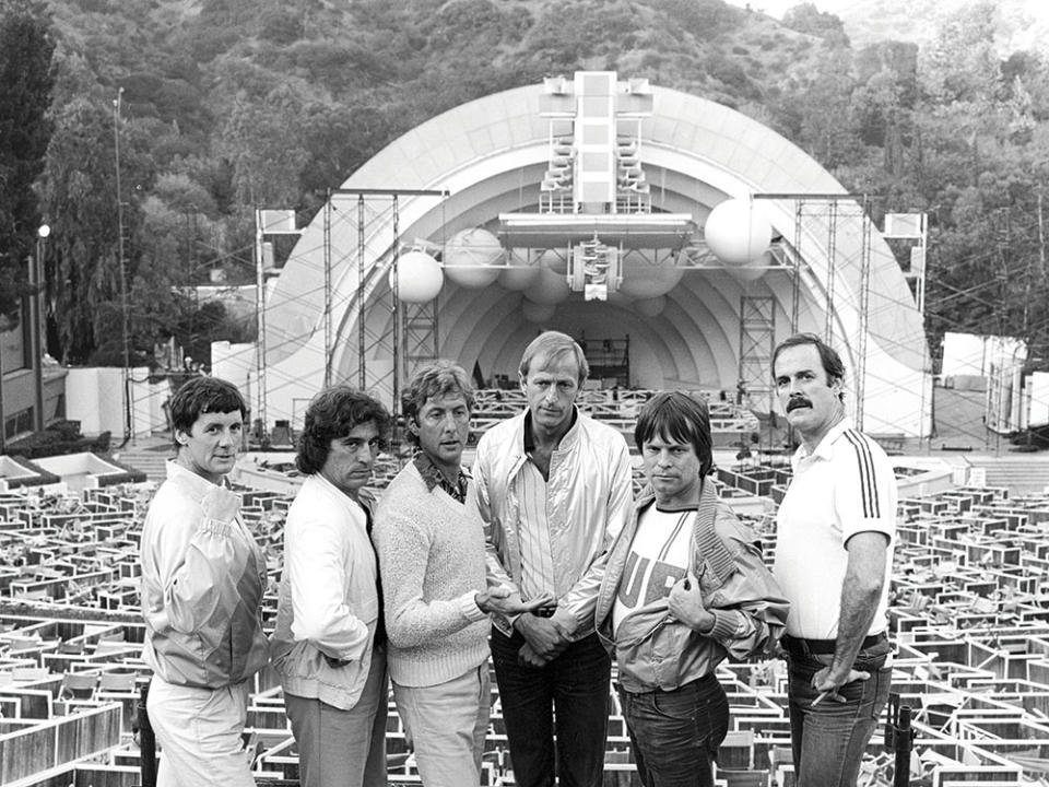 Monty Python at the Hollywood Bowl in 1982. “I’ve played everywhere — I’ve done the Sydney Opera House, I’ve done Carnegie Hall, I’ve done Albert Hall. It’s still the most thrilling place,” says the troupe’s Eric Idle (third from left) of the Bowl. - Credit: Ben Martin/Getty Images