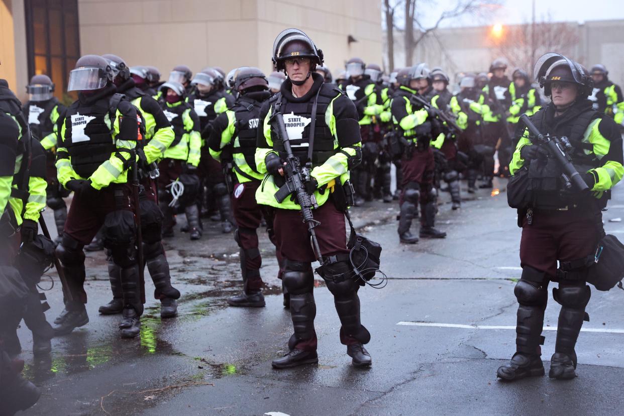 Police officers stand guard outside of the Brooklyn Center police station on April 12, 2021 in Brooklyn Center, Minnesota (Getty Images)