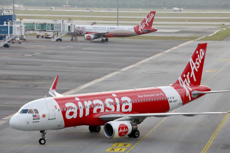 FILE PHOTO: AirAsia planes are seen on the tarmac of Kuala Lumpur International Airport 2 (KLIA2) in Sepang