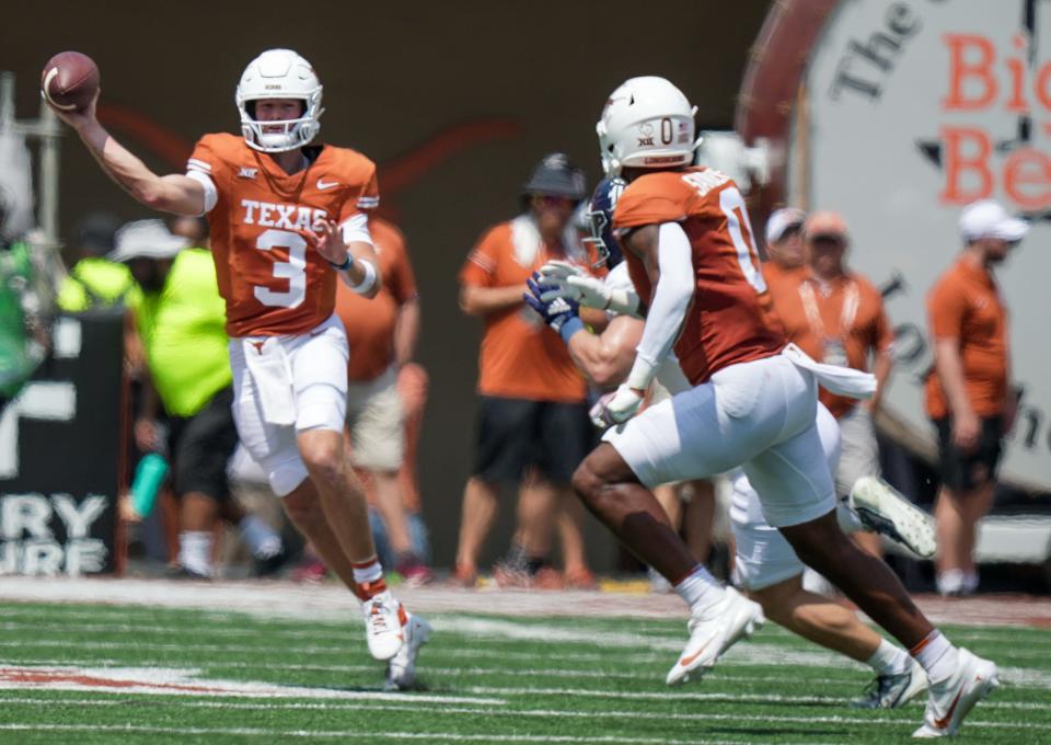 Texas quarterback Quinn Ewers fires a pass to tight end Ja'Tavion Sanders during the first half of last week's 37-10 win over Rice at Royal-Memorial Stadium.