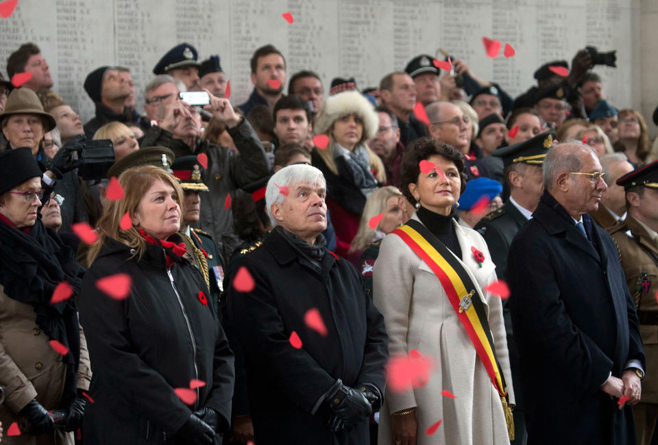 <p>Paper poppies fall from the ceiling of the Menin Gate during an Armistice Day ceremony in Ypres, Belgium on Saturday, Nov. 11, 2017. The Menin Gate Memorial bears the names of more than 54,000 British and Commonwealth soldiers who were killed in the Ypres Salient of World War I and whose graves are not known. (Photo: Virginia Mayo) </p>