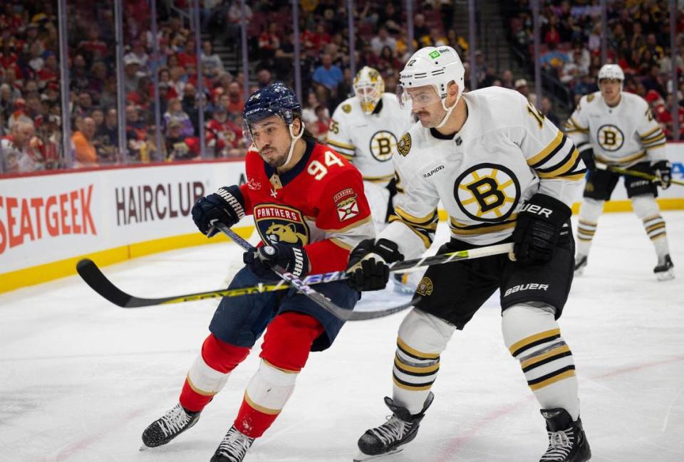 Florida Panthers left wing Ryan Lomberg (94) andBoston Bruins defenseman Kevin Shattenkirk (12) go after the puck during the second period of a NHL game on Wednesday, Nov. 22, 2023, at Amerant Bank Arena in Sunrise, Fla.