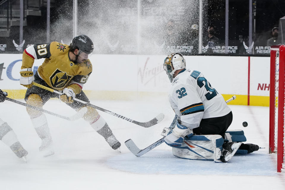 San Jose Sharks goaltender Josef Korenar (32) blocks a shot by Vegas Golden Knights center Chandler Stephenson (20) during the second period of an NHL hockey game Wednesday, April 21, 2021, in Las Vegas. (AP Photo/John Locher)