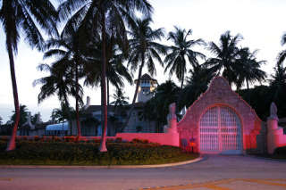 The entrance to former President Donald Trump's Mar-a-Lago estate is shown, Monday, Aug. 8, 2022, in Palm Beach, Fla. Trump said in a lengthy statement that the FBI was conducting a search of his Mar-a-Lago estate and asserted that agents had broken open a safe. (AP Photo/Terry Renna)