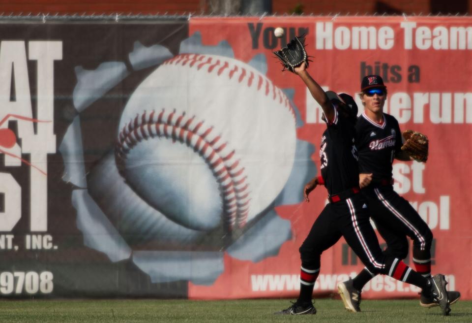 Harrison's Kaiden Bard (23) hauls in a deep fly ball during their sectional semifinal game against Castle at Bosse Field Friday evening, May 26, 2023.