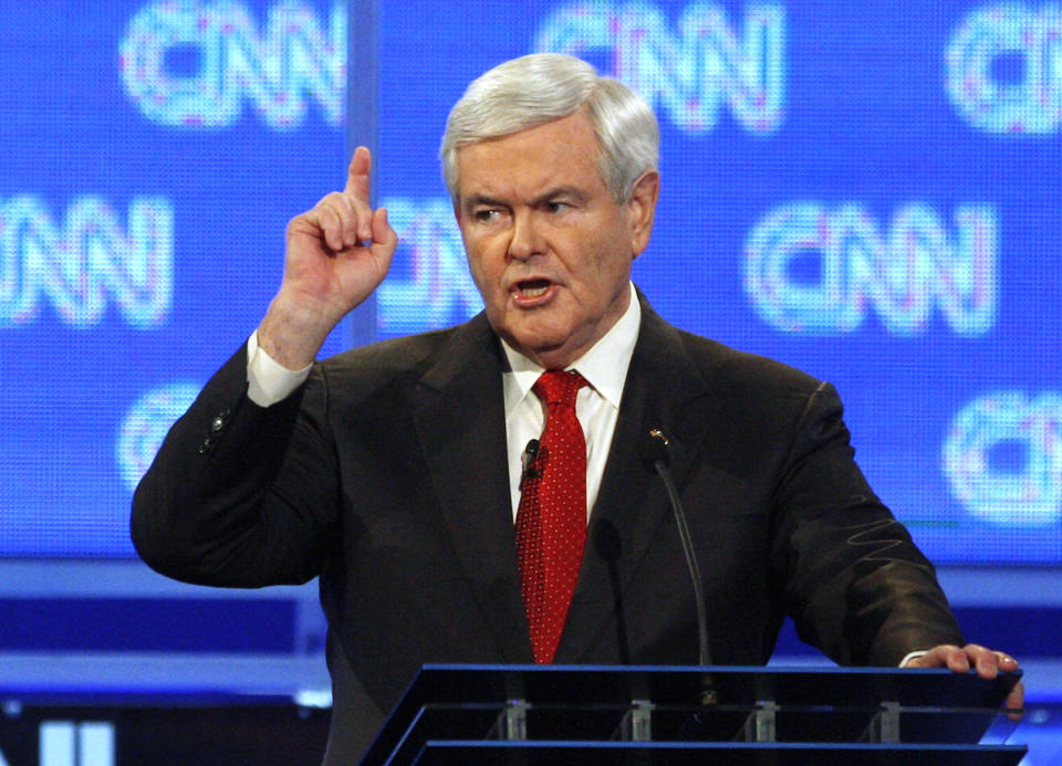 Former House Speaker Newt Gingrich scolds CNN moderator John King at the beginning of a Republican presidential candidates debate in Charleston