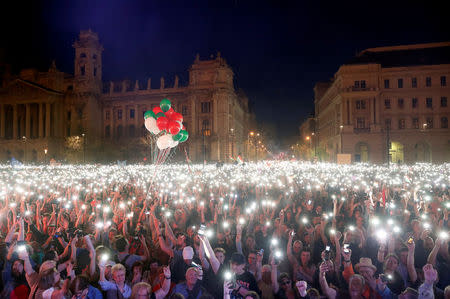 People attend a protest against the government of Prime Minister Viktor Orban in Budapest, Hungary, April 14, 2018. REUTERS/Bernadett Szabo