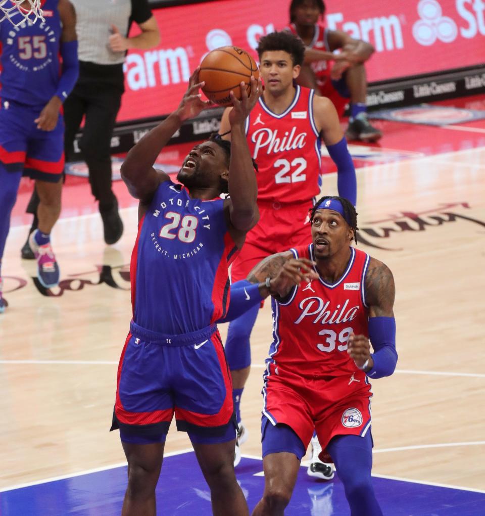 Detroit Pistons center Isaiah Stewart shoots against Philadelphia 76ers center Dwight Howard during the first quarter at Little Caesars Arena, Saturday, Jan. 23, 2021.