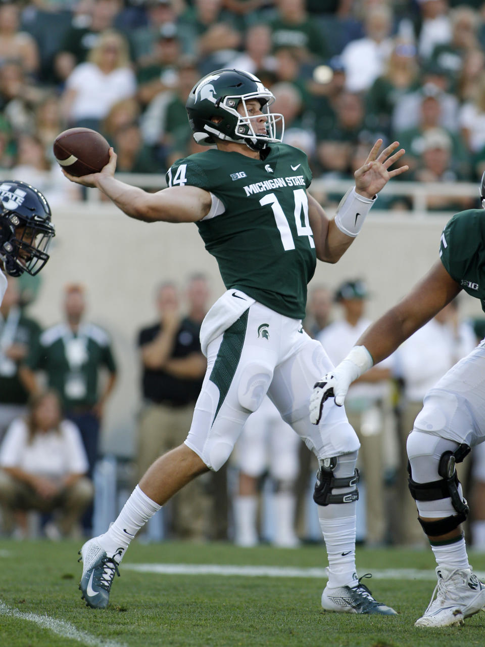 Michigan State quarterback Brian Lewerke throws a pass against Utah State during the first quarter of an NCAA college football game, Friday, Aug. 31, 2018, in East Lansing, Mich. (AP Photo/Al Goldis)