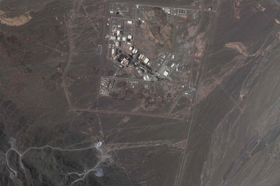 FILE - This satellite image from Planet Labs PBC shows Iran's Natanz nuclear site, as well as ongoing construction to expand the facility in a nearby mountain, near Natanz, Iran, May 9, 2022. Iran started removing 27 surveillance cameras from nuclear sites across the country, the U.N. nuclear watchdog said Thursday, June 9, 2022, further blinding the agency's inspectors from being able to track Tehran's uranium enrichment that is now closer than ever to weapons-grade levels. The U.N.'s nuclear watchdog also said Iran plans to install two new cascades of advanced centrifuges at Natanz that will allow Tehran to rapidly enrich more uranium. (Planet Labs PBC via AP, File)