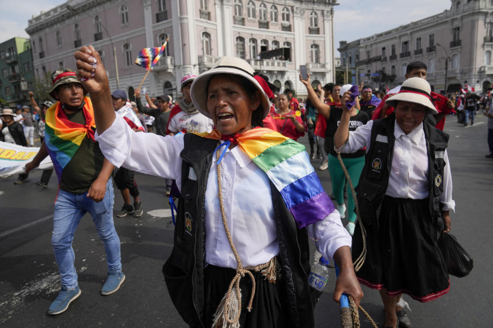 Anti-government protesters march in Lima, Peru, Thursday, Jan. 19, 2023. Protesters are seeking immediate elections, the resignation of President Dina Boluarte, the release from prison of ousted President Pedro Castillo and justice for protesters killed in clashes with police. (AP Photo/Martin Mejia)