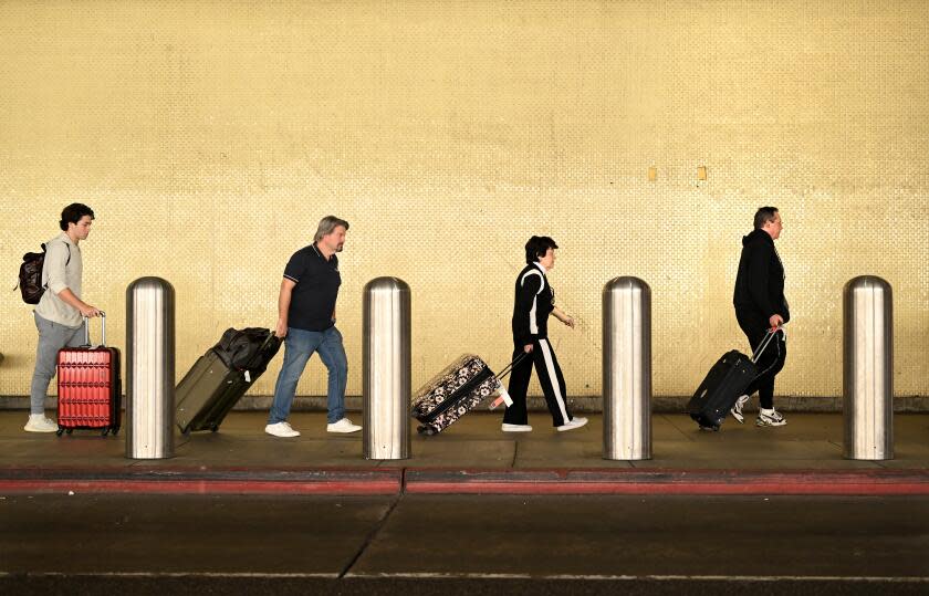 Los Angeles, California November 21, 2023-Holiday travelers make their way at Terminal 7 at LAX in time for the Thanksgiving weekend Tuesday. (Wally Skalij/Los Angeles Times)