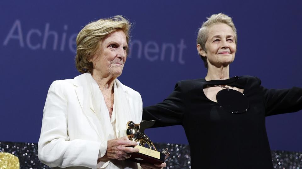 VENICE, ITALY - AUGUST 30: President of the Venice Biennale Roberto Cicutto, Liliana Cavani with the Golden Lion For Lifetime Achievement and Charlotte Rampling on stage at the opening ceremony at the 80th Venice International Film Festival on August 30, 2023 in Venice, Italy. (Photo by Vittorio Zunino Celotto/Getty Images)