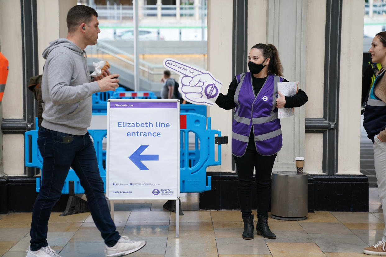 Passengers enter the Elizabeth Line platforms at Paddington Station, London, as the new line opens to passengers for the first time. The delayed and overbudget line will boost capacity and cut journey times for east-west travel across the capital. Picture date: Tuesday May 24, 2022.