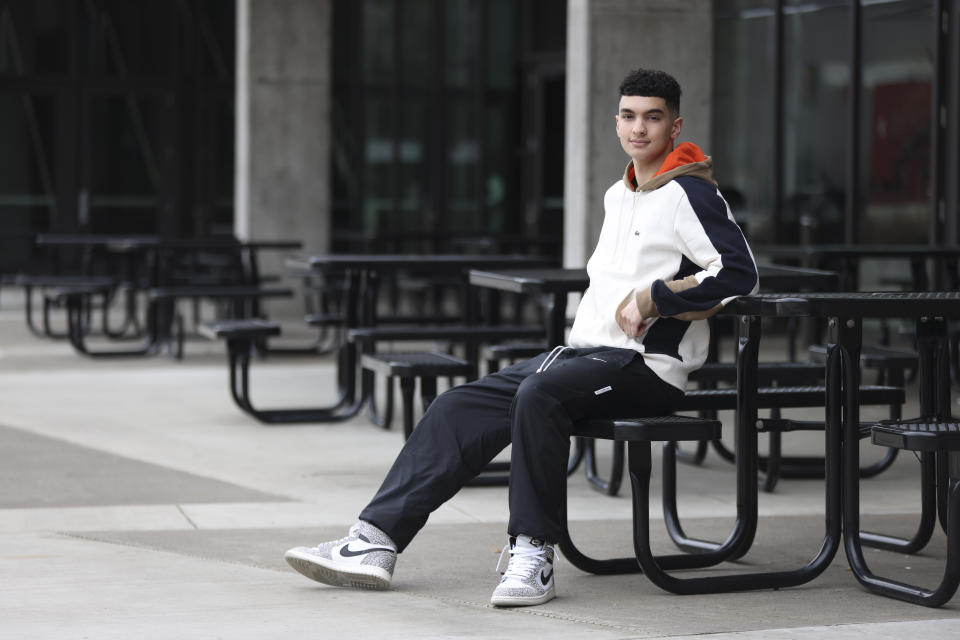 Max Decker, a senior at Lincoln High School, sits for a portrait outside of the school in Portland, Ore., Wednesday, March 20, 2024. (AP Photo/Amanda Loman)