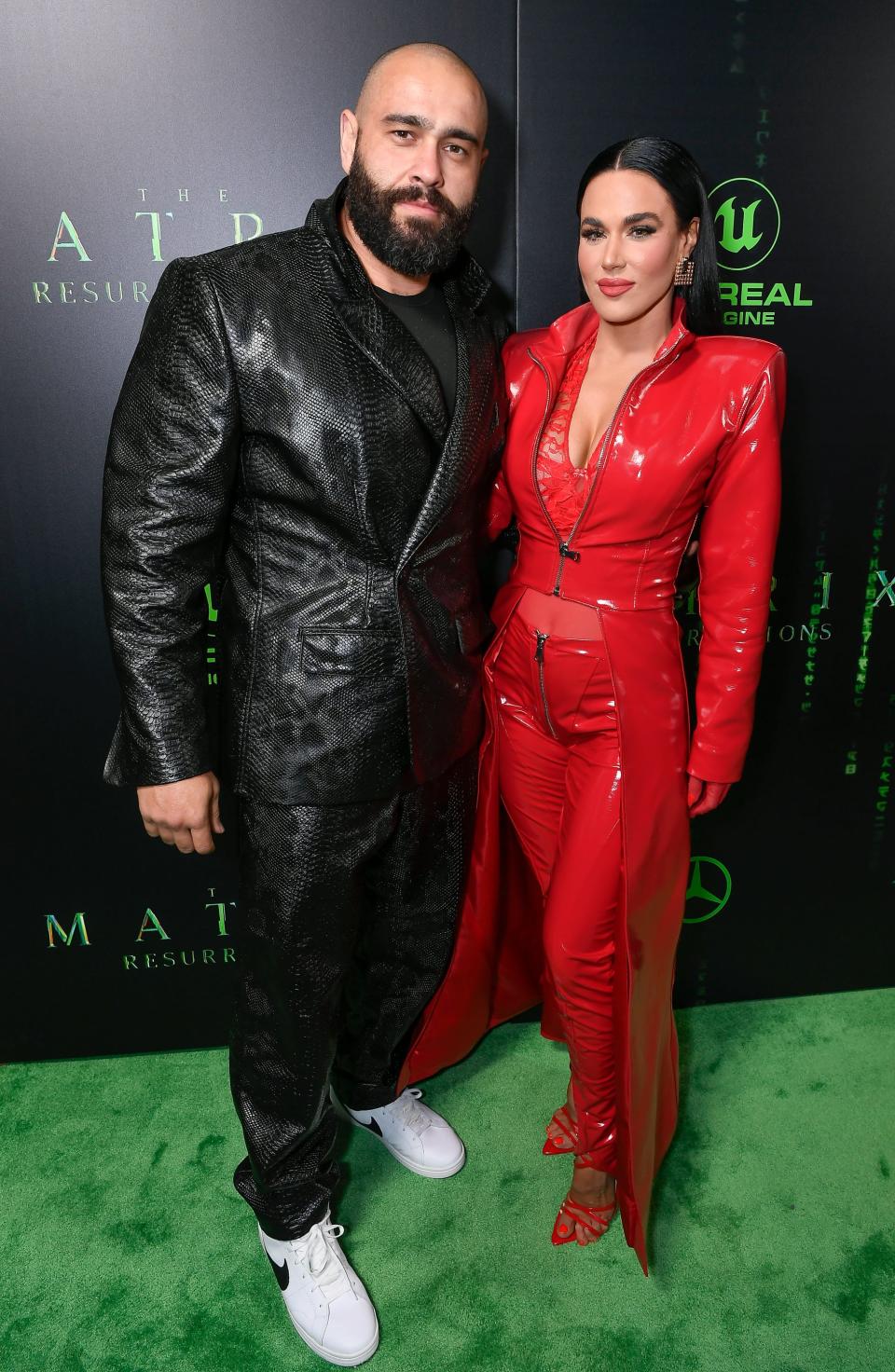 Professional wrestlers Miro and CJ Perry attend "The Matrix Resurrections" US premiere.