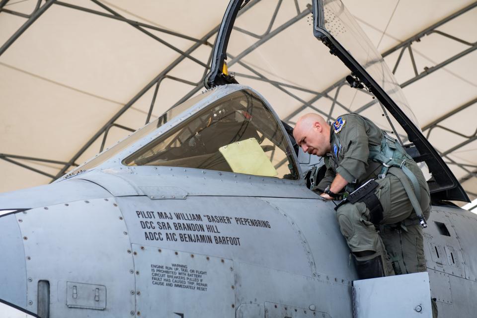 Lt. Col. Matthew Shelly, commander of the 74th Fighter Squadron,  conducts pre-flight inspection of his A-10C Thunderbolt II attack aircraft at Moody Air Force Base on June 26, 2021.