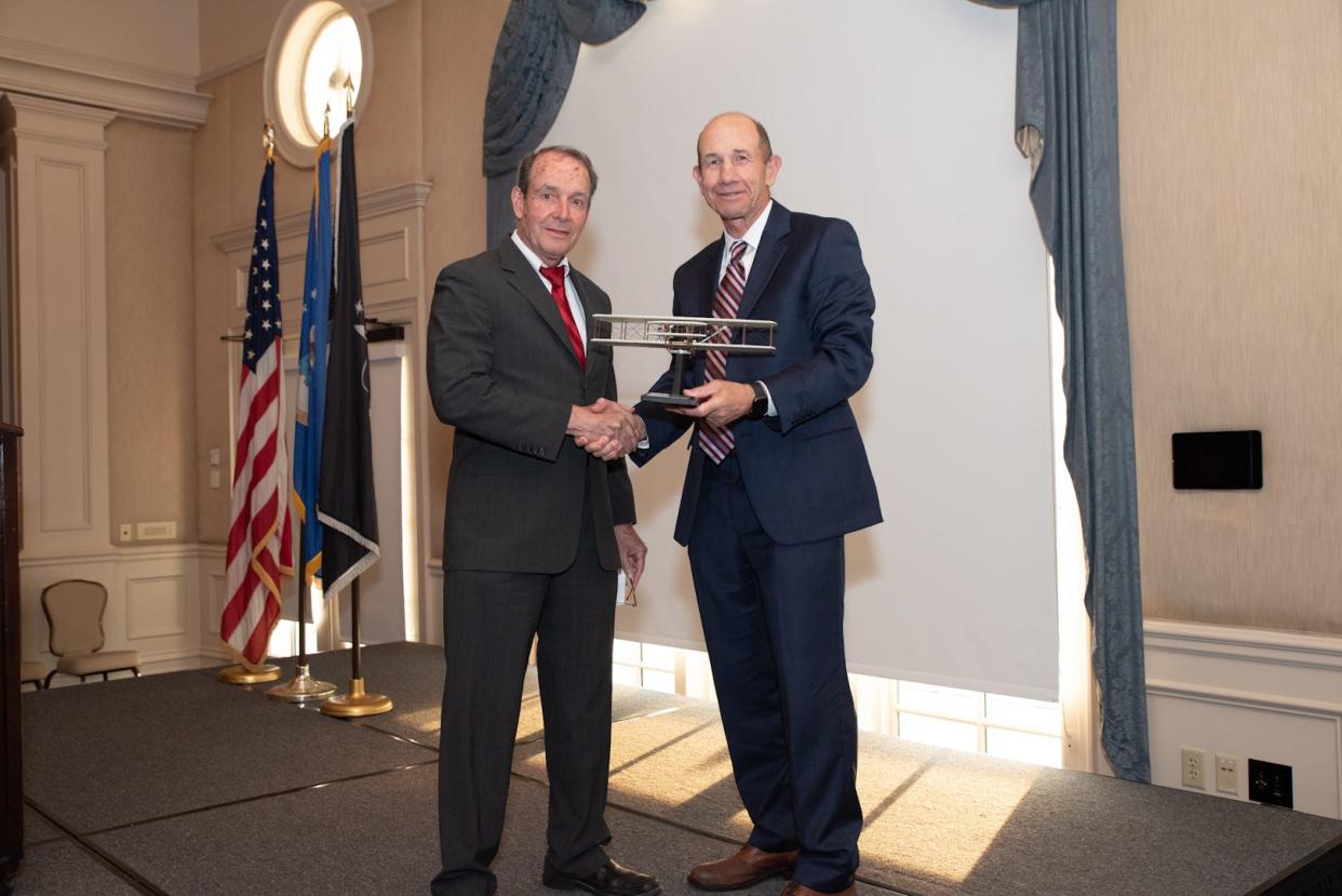 General Mike Holmes, USAF, Retired, chairman of the board of the Air Force Historical Foundation, presents Dr. Daniel L. Haulman, PhD., of Montgomery with the Major General I.B. Holley Award.