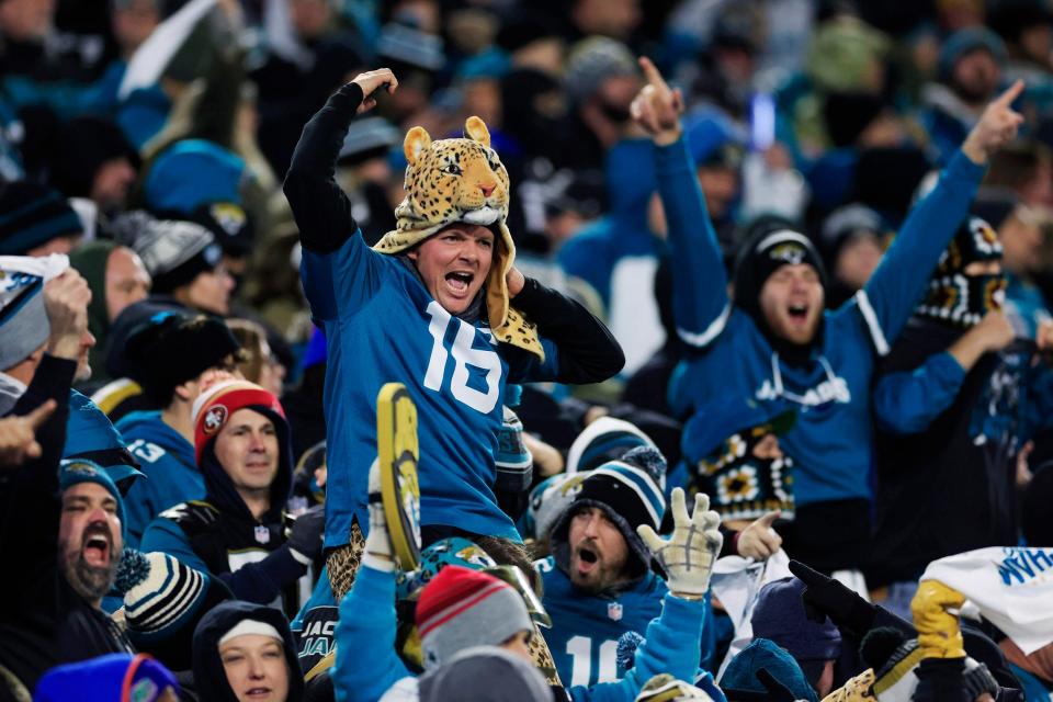 Jaguars fans celebrate Trevor Lawrence's two-point conversion in January's playoff win against the Chargers, a comeback that placed Jacksonville in the national sports spotlight.