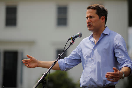 FILE PHOTO: U.S. Congressman Seth Moulton (D-MA) speaks at a Merrimack County Democrats Summer Social at the Swett home in Bow, New Hampshire, U.S., July 28, 2018. REUTERS/Brian Snyder