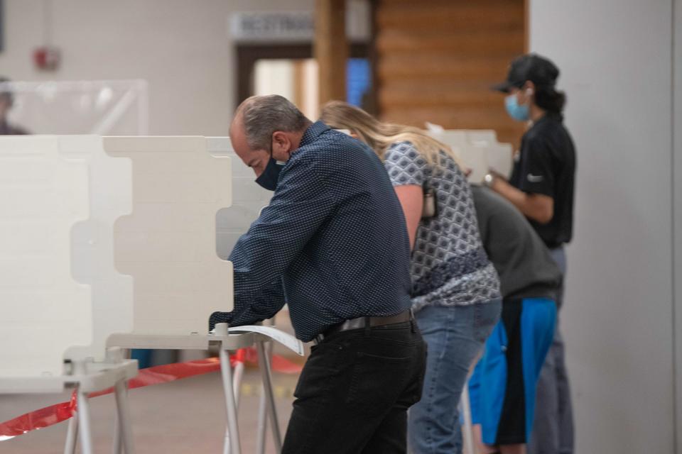 Voters cast their ballots at the Colorado State Fairgrounds in-person on Election Day of 2020.