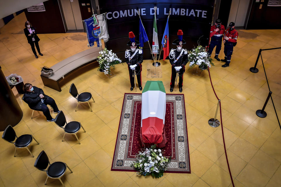 Carabinieri officers stand by the coffin of Italian ambassador to the Democratic Republic of Congo Luca Attanasio, in Limbiate, near Milan, Italy, Friday, Feb. 26, 2021. Italy paid tribute to its ambassador to Congo and his bodyguard who were killed in an attack on a U.N. convoy, honoring them with a state funeral Thursday. (Claudio Furlan/LaPresse via AP)