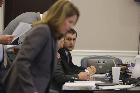 Former North Charleston Police Officer Michael Slager (C) sits at the defense table during testimony in Slager's murder trial in Charleston, South Carolina, U.S. November 7, 2016, REUTERS/Grace Beahm/Pool