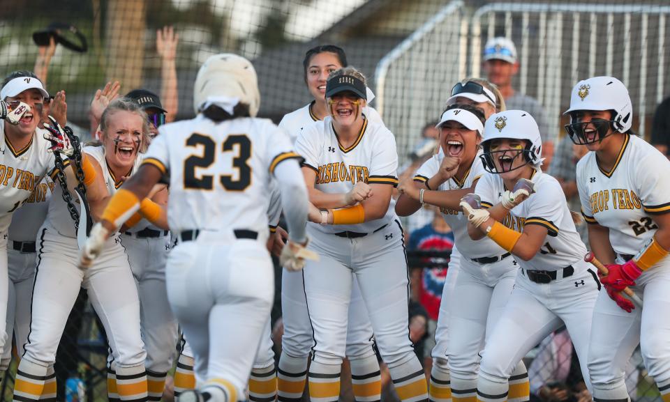 Bishop Verot Vikings players crowd home plate to celebrate a home run by outfielder Camryn Feast (23) during the ninth inning of the Private 8 tournament final against the Evangelical Christian School Sentinels at Evangelical Christian School in Fort Myers on Thursday, March 9, 2023.