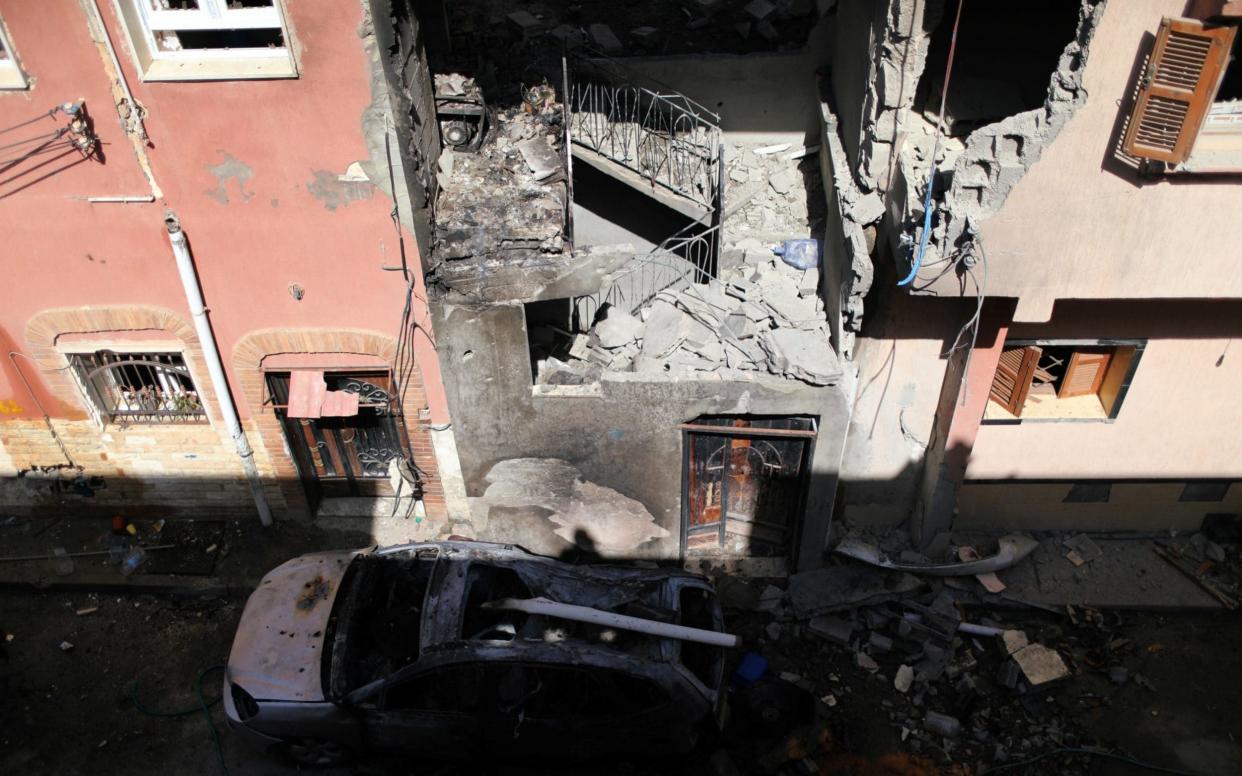 General view of a house damaged by an overnight shelling in Abu Salim district in Tripoli - REUUTERS