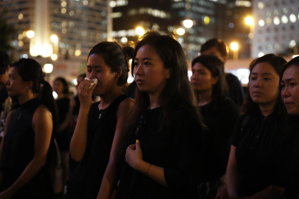 Attendees take part in a candle light vigil for the fourth apparent suicide related to the protests against an extradition law to China in Hong Kong on Wednesday, July 10, 2019. It's still the world's "freest" economy, one of the biggest global financial centers and a scenic haven for tycoons and tourists, but the waves of protests rocking Hong Kong are exposing strains unlikely to dissipate as communist-ruled Beijing's influence grows.(AP Photo/Vincent Yu)