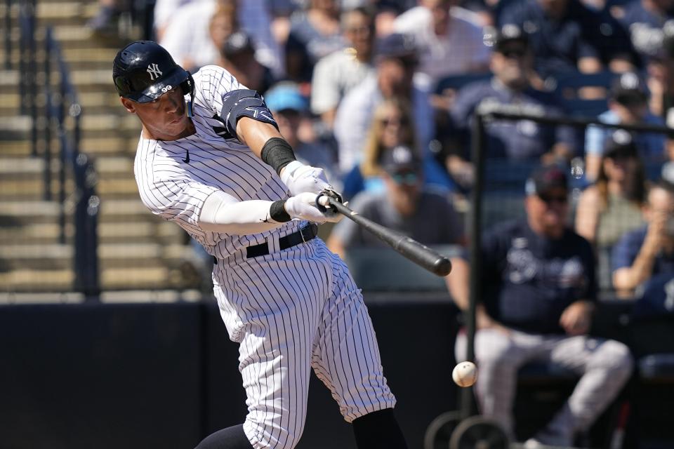 New York Yankees' Aaron Judge (99) swings for a strike during the second inning of a spring training baseball game against the Atlanta Braves Sunday, Feb. 26, 2023, in Tampa, Fla. (AP Photo/David J. Phillip)