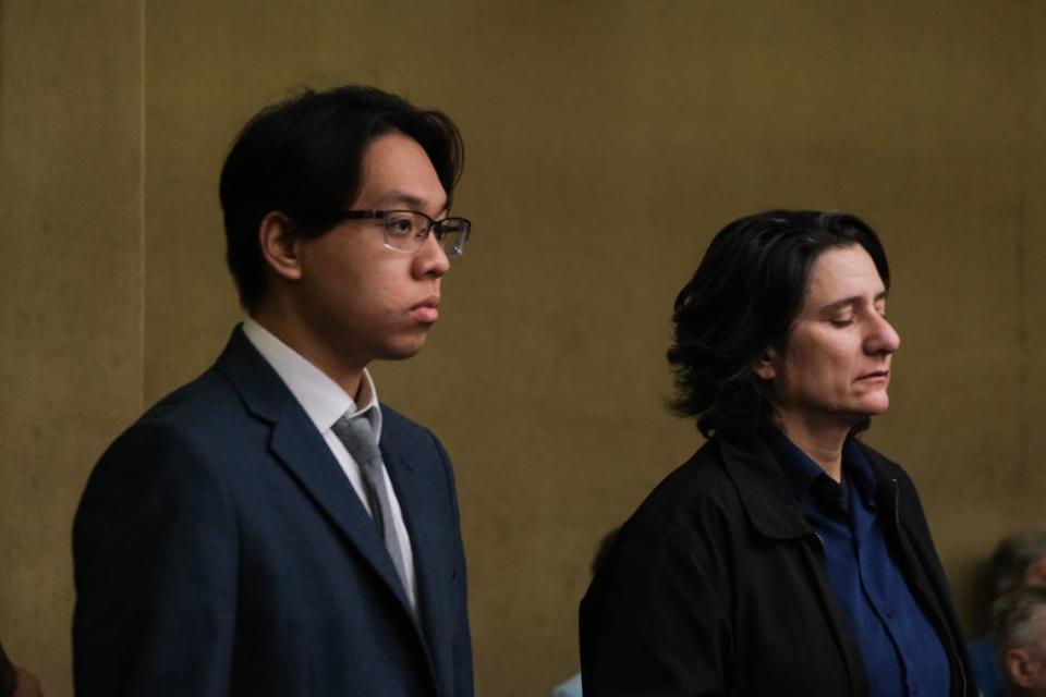 Brandon Pham, left, stands with his attorney Adrienne Haddad at a court hearing in San Luis Obispo Superior Court on Dec. 20, 2023.