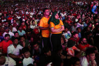Fans watch the World Cup, group A soccer match between Qatar and Ecuador at the fan zone in Doha, Sunday, Nov. 20, 2022. (AP Photo/Petr David Josek)