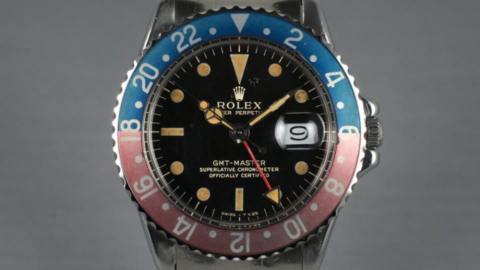 Faded aluminum bezels and creamy “lume” are the marks of a “tasty four-digit GMT.” This is a 1675.